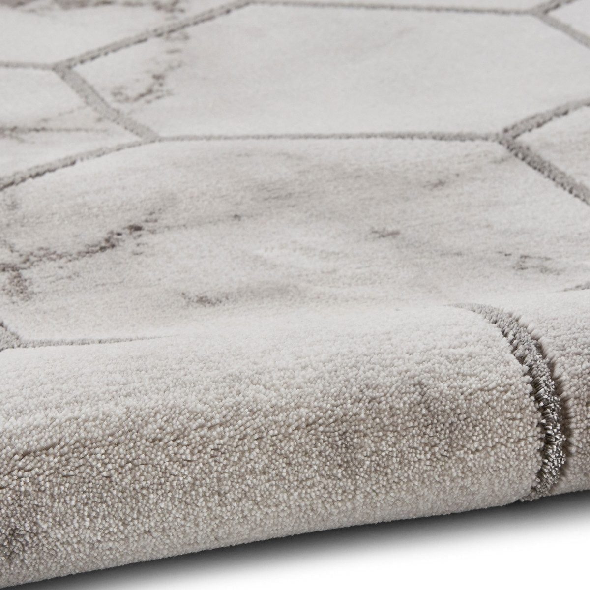 Tapis artisanal gris et argent à motif hexagonal