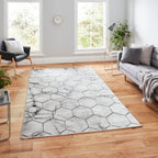 Tapis artisanal gris et argent à motif hexagonal