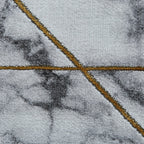 Tapis géométrique artisanal ivoire et or