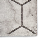 Tapis artisanal gris et argent à motif hexagonal