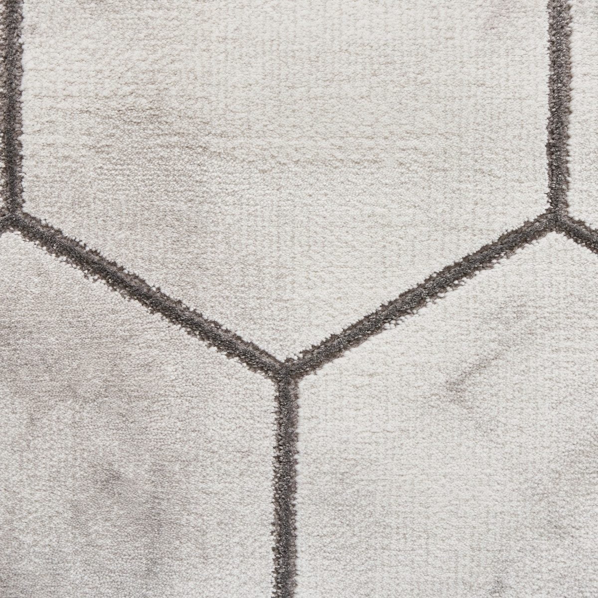 Tapis artisanal gris et argent à motif hexagonal