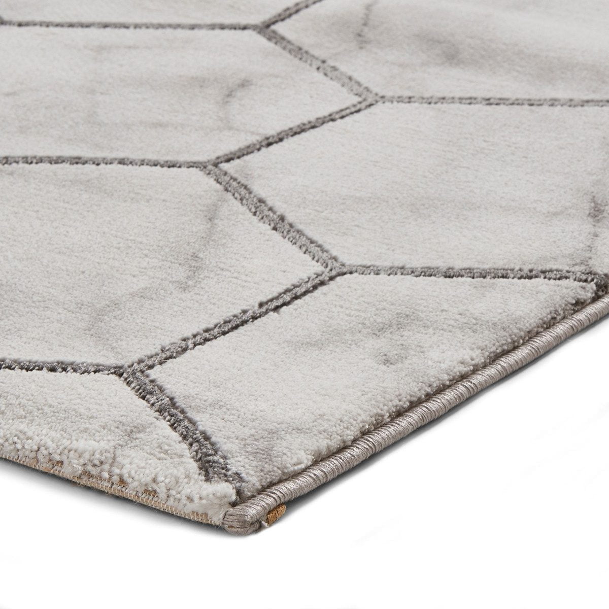 Tapis artisanal gris et argent à motif hexagonal