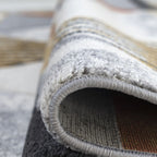 Tapis géométrique triangulaire Mason moutarde et gris