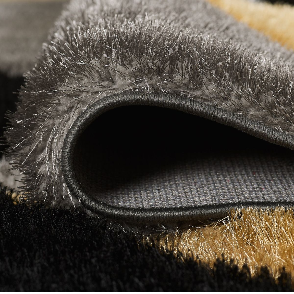 Tapis géométrique Pluton gris et or