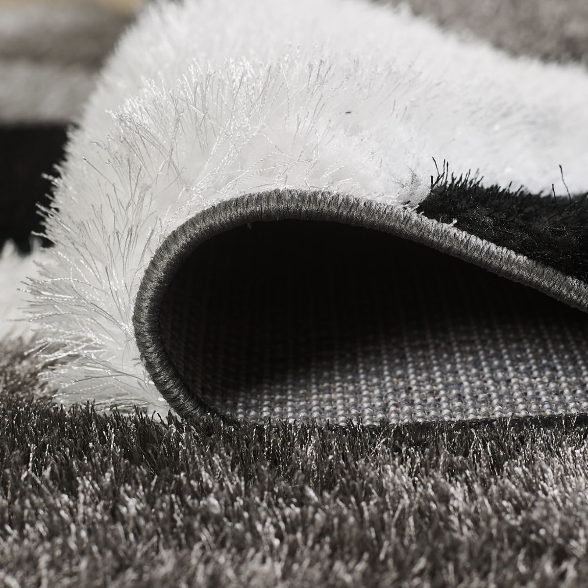 Tapis géométrique noir et blanc Pluton